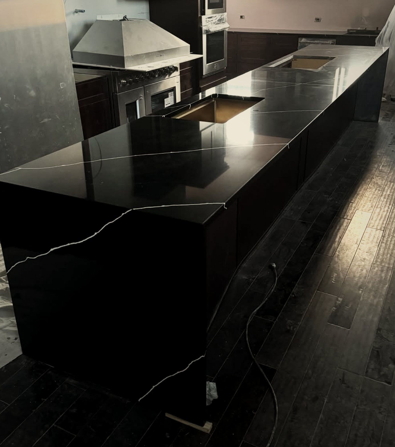 Long black quartz island with waterfall end